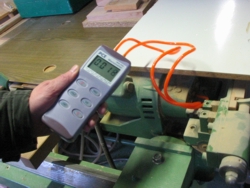 The PCE-P15 Differential Pressure Gauge measuring pressure in industrial machine